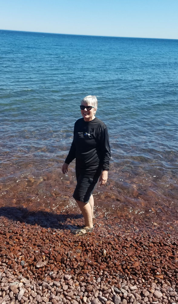 Phyllis testing the waters of retirement during an excursion on Lake Superior. 